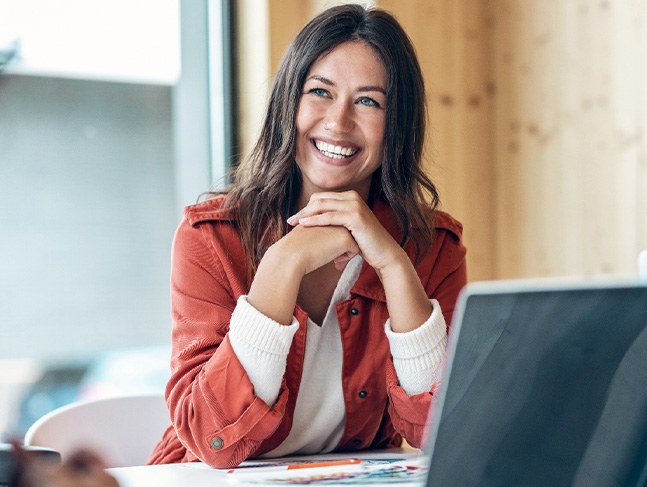 Woman smiling during meeting in office