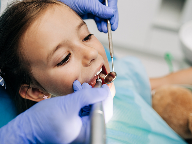 Young girl getting a dental exam