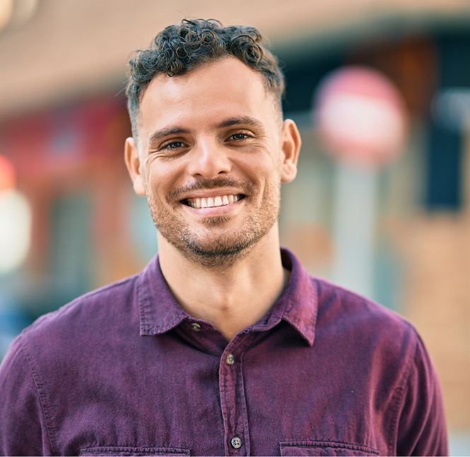Man smiling with dental bridges in San Antonio