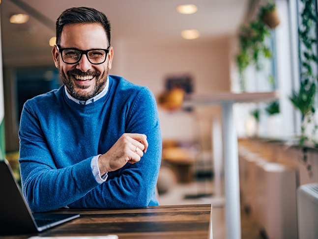 Smiling man in a blue sweater