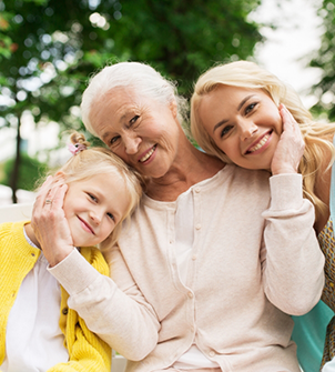 Senior woman smiling with her daughter and granddaughter