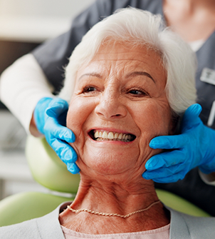 Senior woman grinning in the dental chair