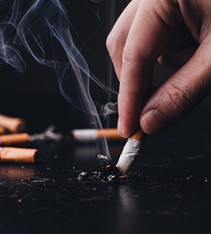 Person putting out a cigarette