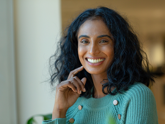Smiling woman in a light blue sweater