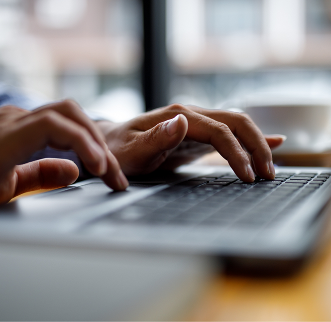 Person typing on a laptop