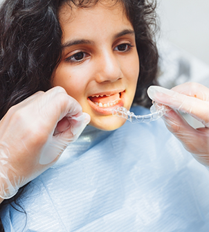 Teenage girl being fitted for Invisalign