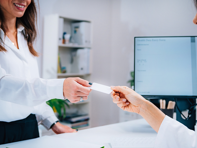 Person paying for their dental treatment