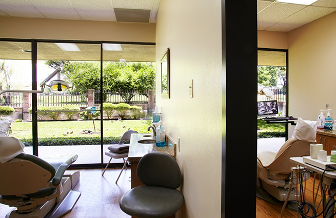 Two dental treatment rooms visible from a hallway