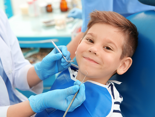 Young boy smiling in the dental chair