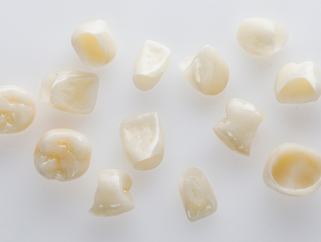 Several tooth-colored dental crowns