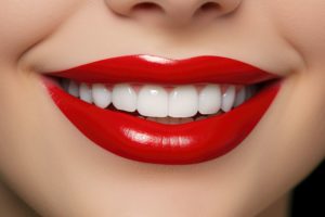 Closeup of a smile with blue-red lipstick